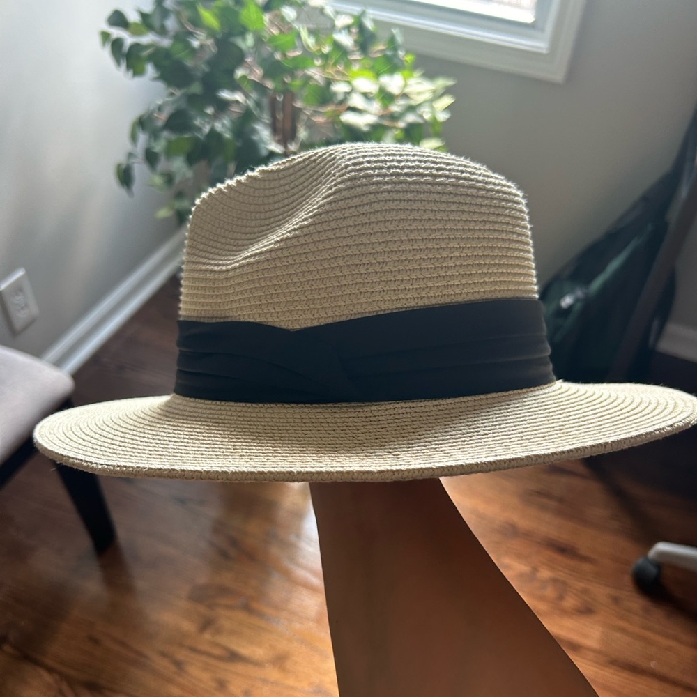 Tan sun hat with black ribbon